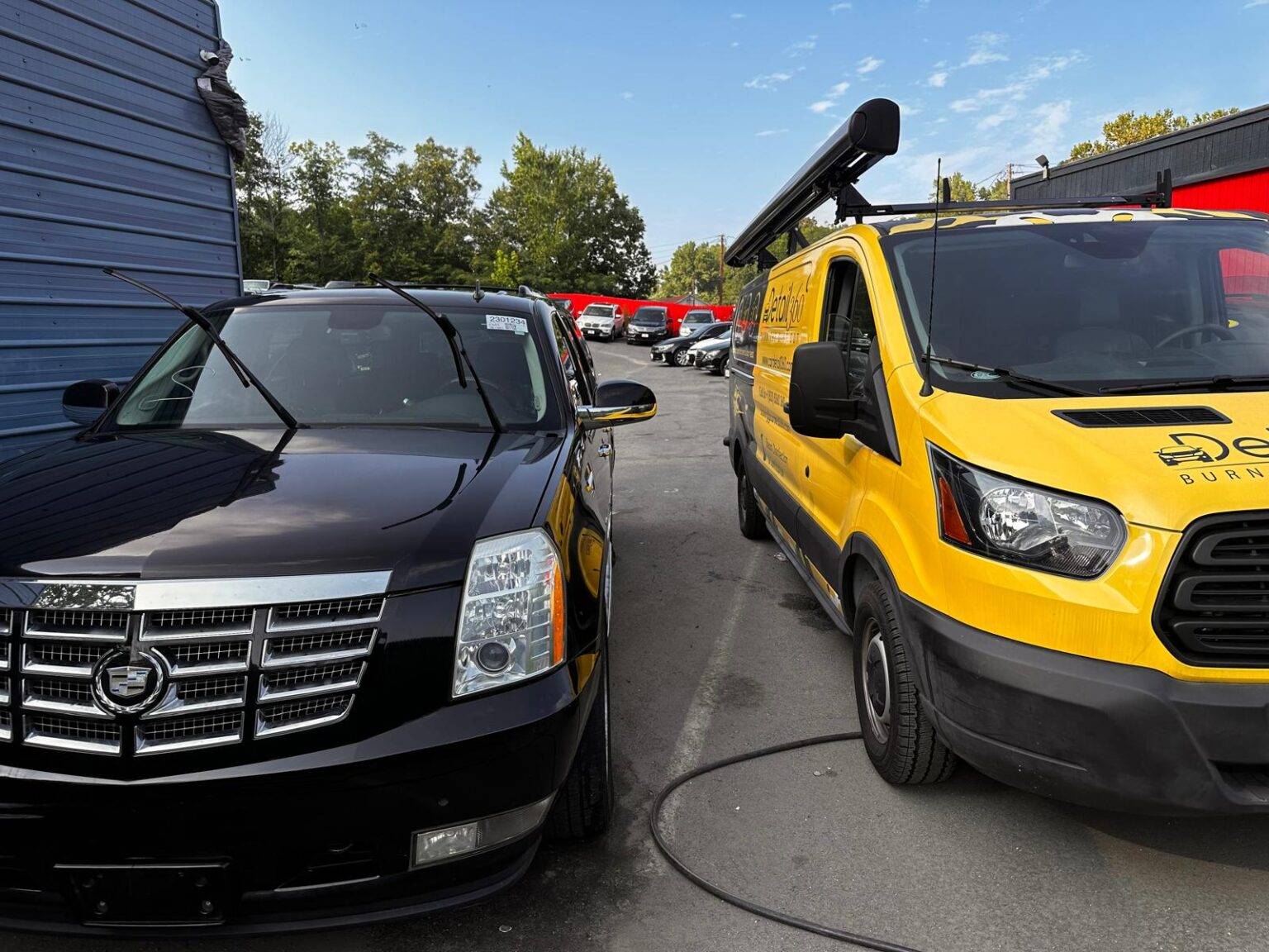 Car Detail 360 mobile biohazard unit beside an SUV