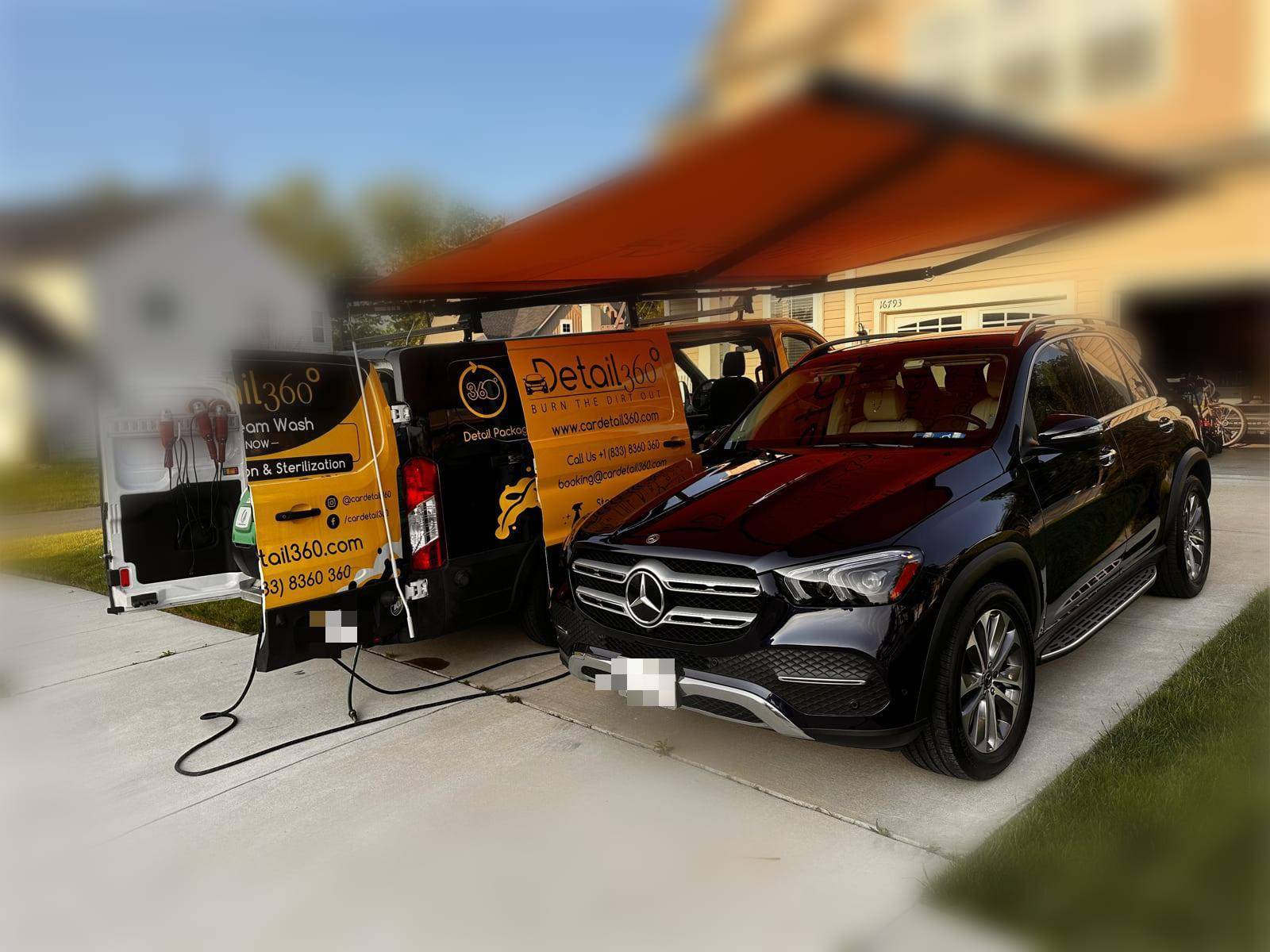 Car Detail 360 mobile unit beside a Mercedes-Benz GLE
